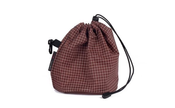 A Medium, clear-bottomed Yarn Stuff Sack in Moab (brick red with white grid) 200 Halcyon.